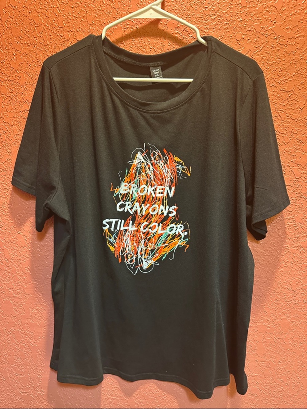 Black Graphic Tee with Colorful Crayon Design